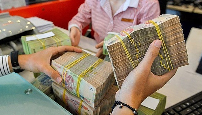 Lãi suất tiền gửi bất ngờ giảm trước Tết - Ảnh 1. Lãi suất tiền gửi bất ngờ giảm trước Tết - Ảnh 1.