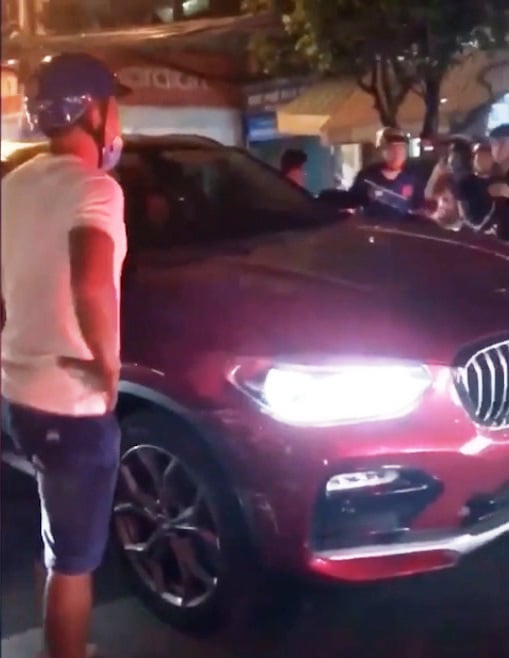 Xử lý thế nào vụ nữ lái xe ô tô BMW gây tai nạn rồi bỏ chạy - Ảnh 1.