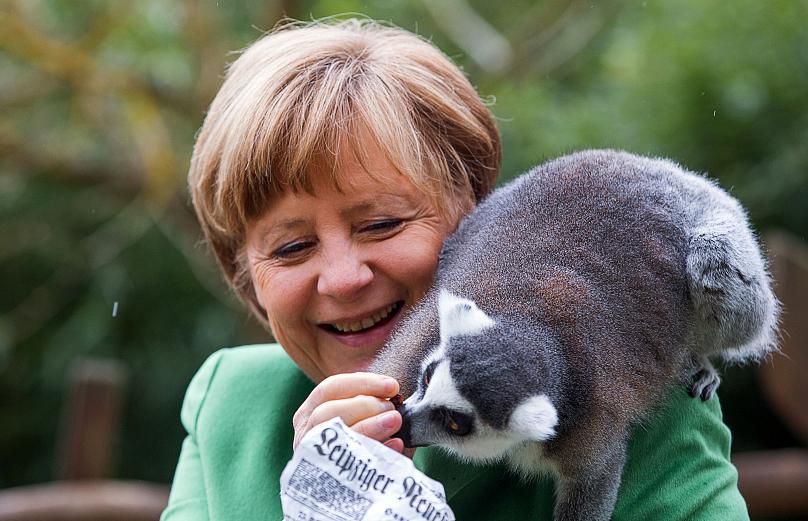 Những hình ảnh đẹp nhất của bà Merkel trong 16 năm cầm quyền - Ảnh 10.