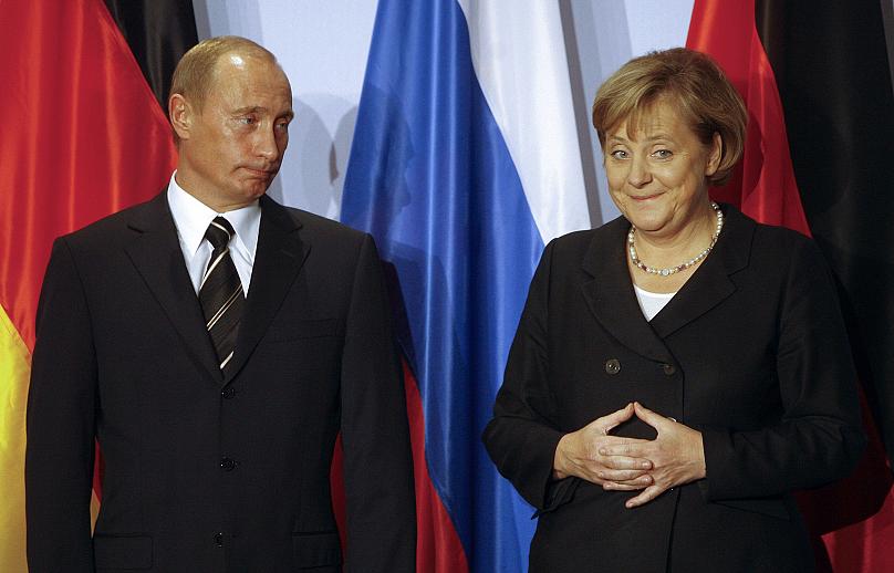 Những hình ảnh đẹp nhất của bà Merkel trong 16 năm cầm quyền - Ảnh 2.
