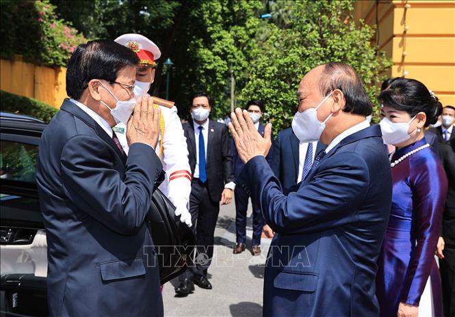 Ảnh: Lễ đón Tổng Bí thư, Chủ tịch nước Lào thăm hữu nghị chính thức Việt Nam - Ảnh 1.
