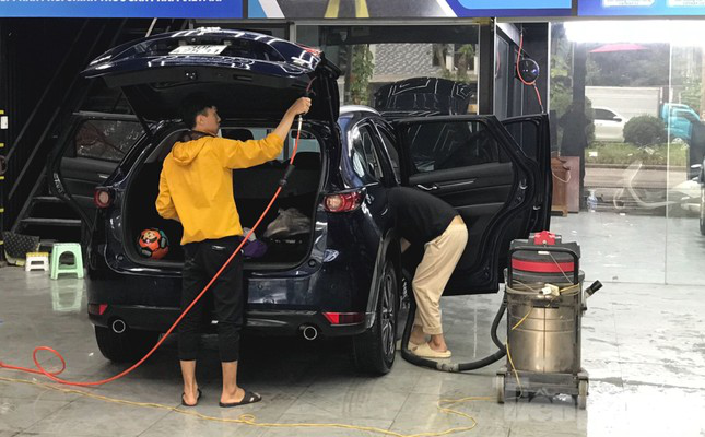 Người dùng tấp nập đưa ô tô đi bảo dưỡng dịp cận Tết - Ảnh 6.
