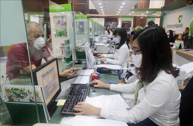 Ngân hàng tung lì xì hấp dẫn, hút tiền gửi sau Tết - Ảnh 1.