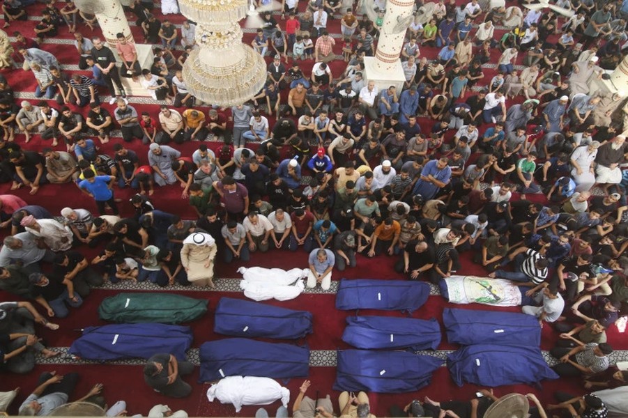 Cảnh tàn phá và đau thương khi hơn 1.100 người thiệt mạng trong xung đột Israel-Hamas - Ảnh 13.