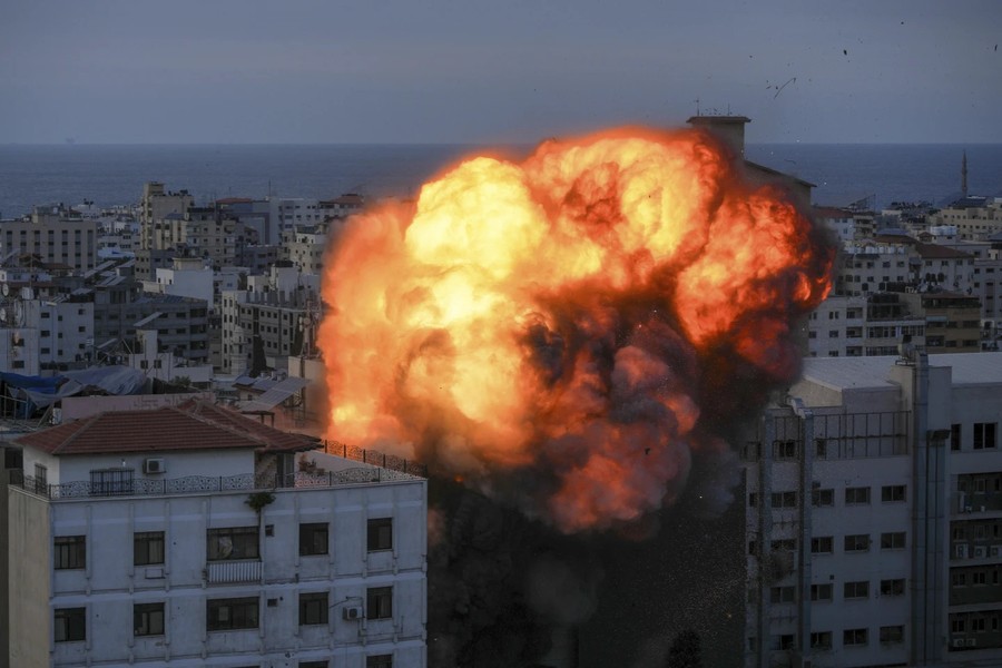 Cảnh tàn phá và đau thương khi hơn 1.100 người thiệt mạng trong xung đột Israel-Hamas - Ảnh 2.