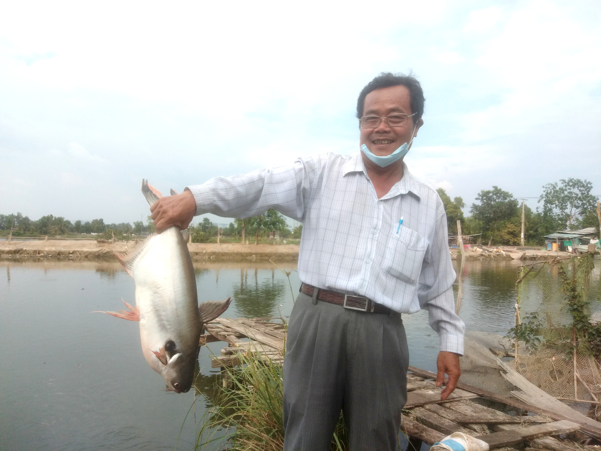 Xóm nghèo đổi đời nhờ con cá tra - Ảnh 3.