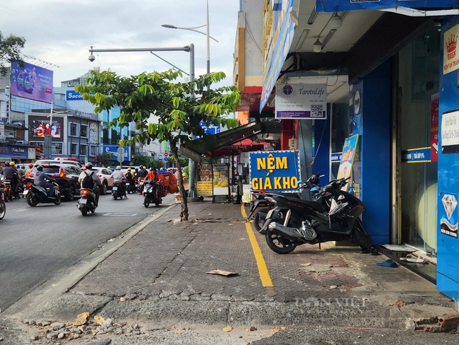 TP.HCM đã có hướng dẫn thu phí sử dụng tạm lòng đường, hè phố, các quận trung tâm có mức thu cao nhất - Ảnh 3.