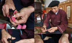 Tết Nguyên đán, người Cao Lan dán giấy đỏ khắp nhà, vườn tược, dụng cụ lao động